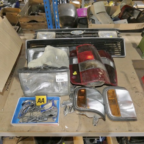 5395 - A quantity of various vintage car parts including lights, 2 x grilles, badges etc - including Ford C... 