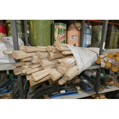 5718 - A quantity of various wooden handles for axes, pick axes etc. Contents of 1 shelf