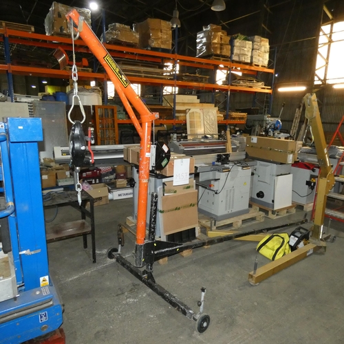 5890 - A large red / black metal wheeled man lifting frame by Land and Marine Products Ltd with a UCL Safet... 