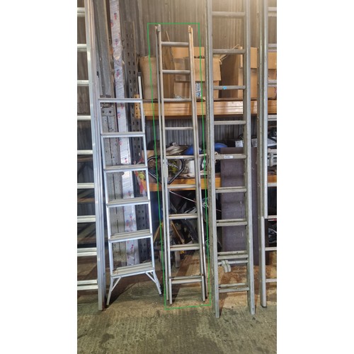 6047 - A double extending aluminium ladder (2 x 9 rung)