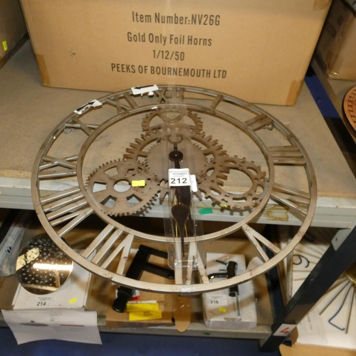 212 - A brown metal skeletal wall clock diameter approx 50cm