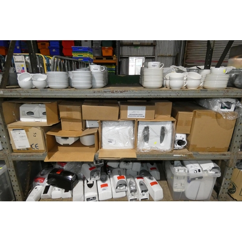 1062 - A quantity of various soap dispensers, towel dispensers, soap dispensers, etc. Contents of 1 shelf