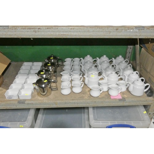 1067 - A quantity of various white crockery including teapots milk jugs etc.