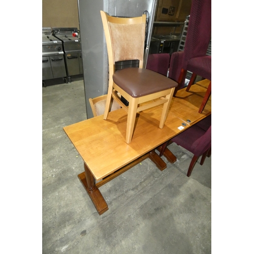 1301 - A wooden restaurant/pub type table with 2 matching cream/brown upholstered dining chairs