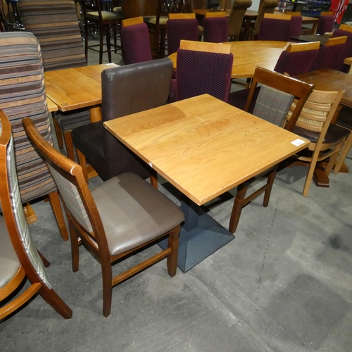 1310 - A square wooden restaurant/pub type table with 2 matching brown upholstered dining chairs