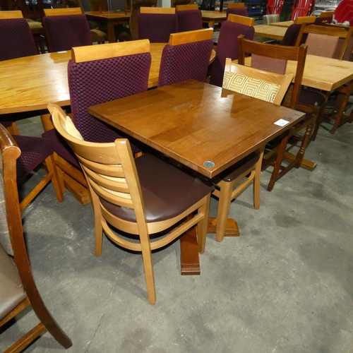 1311 - A square wooden restaurant/pub type table with 2 matching brown upholstered dining chairs