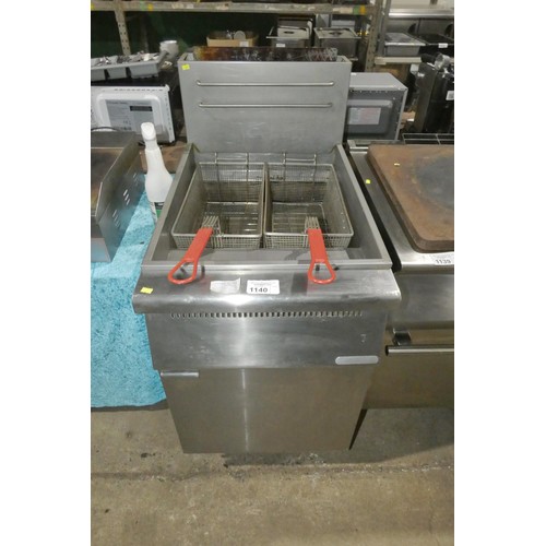 1140 - A commercial stainless steel twin basket deep fryer, by food service equipment - model FGF500 - trad... 