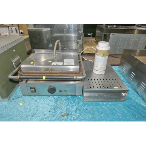 1142 - A commercial stainless steel contact grill, a coffee knock out box, please note the grill tripped th... 