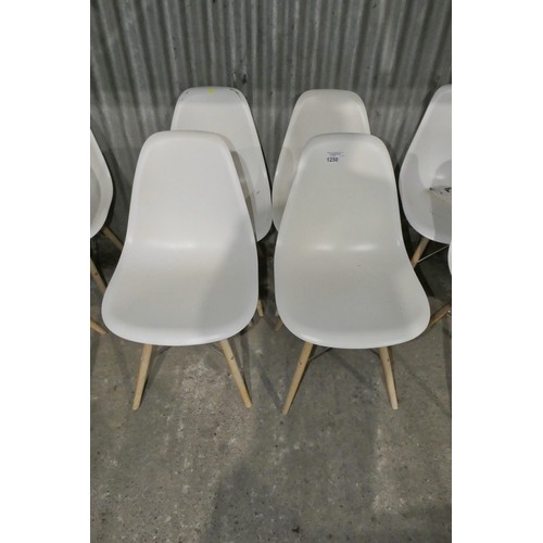 1250 - 4 x white plastic designer style chairs with metal / wood frames