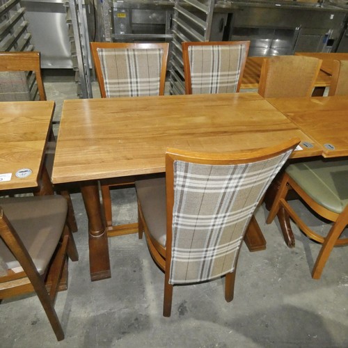 1304 - A wooden restaurant/pub type table with 3 matching brown upholstered dining chairs