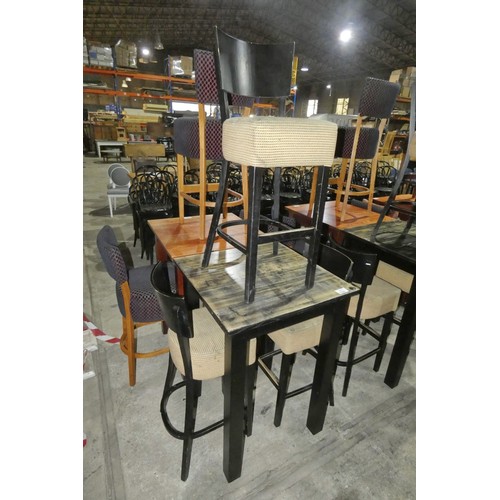 1324 - A tall square wooden restaurant/pub type table with 3 matching upholstered tall dining stools with b... 