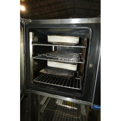 1023 - A commercial stainless steel mobile fan oven by Blue Seal type Turbofan, type E32D4 240v - trade