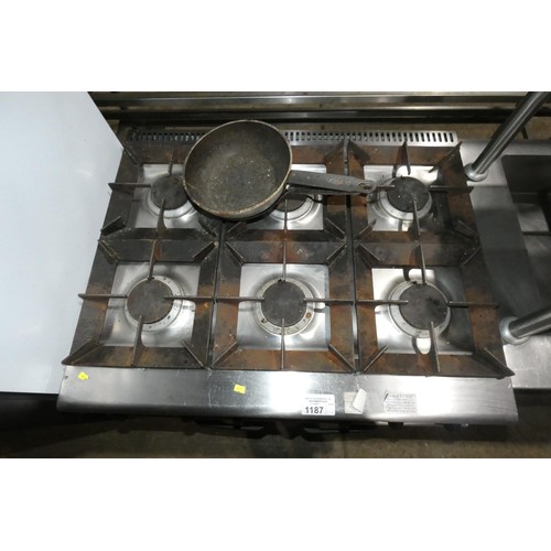 1187 - A commercial stainless steel gas fired 6 ring range with 2 door oven beneath - trade