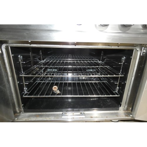 1187 - A commercial stainless steel gas fired 6 ring range with 2 door oven beneath - trade