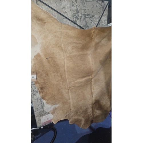 536 - 1 x Bryan cowhide beige rug approx 150 x 170cm (irregular shape as genuine cowhide) RRP £214. Please... 