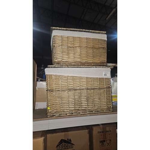 282 - 2 x graduating size fabric lined baskets - largest is approx 57 x 40 x 39cm high