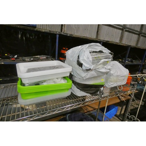 2035 - A quantity of various small plastic trays with lids (exact use unknown)