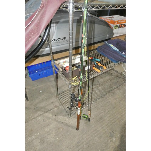 2036 - A quantity of various fishing related items including rods, reels, a tackle box etc