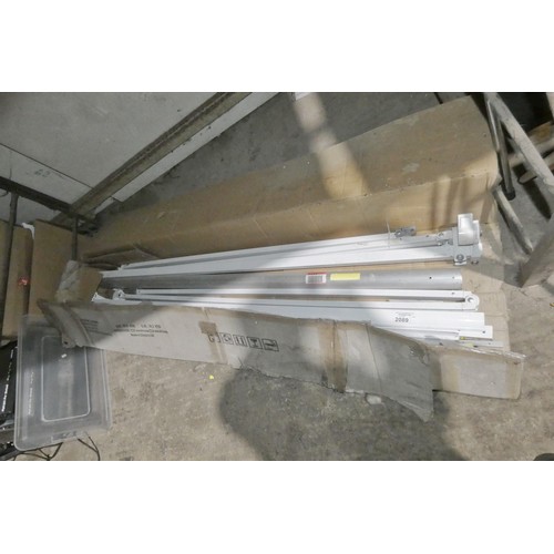 2089 - 1 box containing parts of a PM0583 bolt to wall wind out awning - Incomplete - No fabric awning incl... 