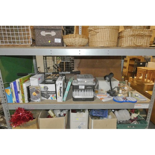 2111 - A quantity of various household items including a coin sorter, a table lamp 240v, books, DVDs etc. C... 