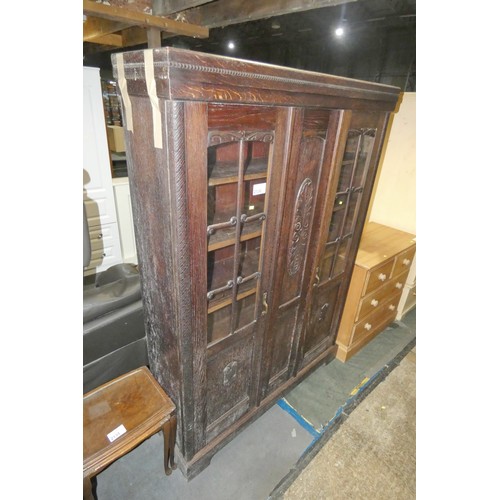 2136 - A dark wood storage / display cabinet with two part glazed doors and shelves inside approx 133cm w x... 