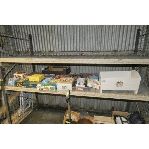 2181 - A quantity of various games and a small painted wooden dolls cot / cradle. Contents of 1 shelf