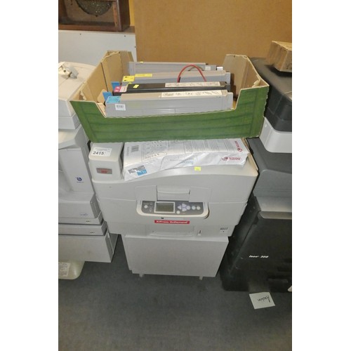 2415 - An office printer by Oki type N31204B, comes with a cabinet and spare, part used cartridges - trade