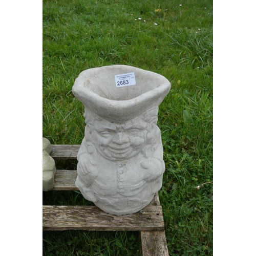 2683 - A concrete Toby jug planter/umbrella stand