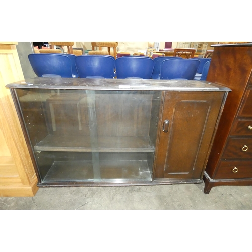 2714 - A dark wood sideboard with 2 glass sliding doors and single door cupboard approx 137x33x88cm