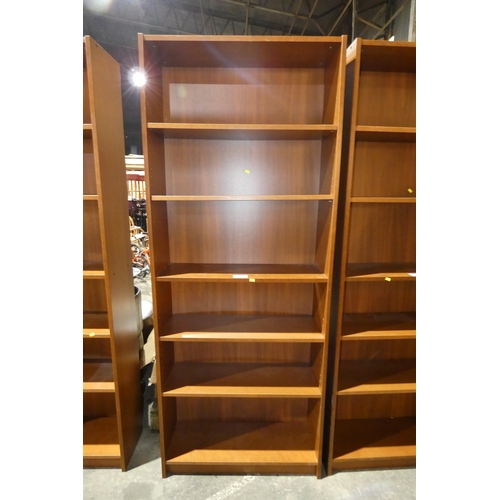 2788 - A tall dark wood bookcase with 5 shelves approx 80x29x203cm