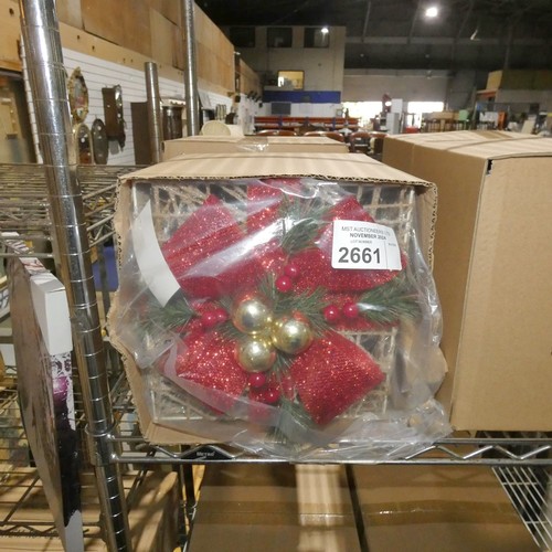 2661 - 2 x boxes containing 2 sets of 3 light up parcel decorations, battery powered for indoor use