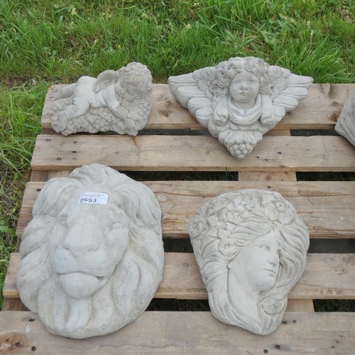 2693 - A quantity of various garden ornaments including a lion face, 2 wall mounted plaque planters & a che... 