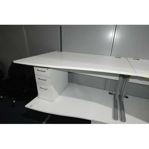 1439 - 1 x white piano / wave front office table approx 140 x 100cm supplied with a white under work top pe... 