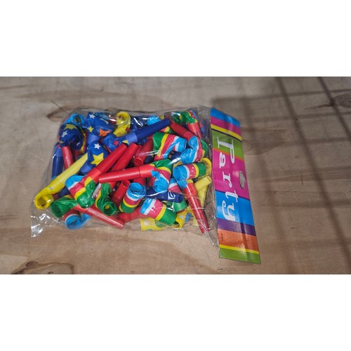 2598 - A box containing 4 smaller boxes with 6 packets of 25 party blowers (approx 600)