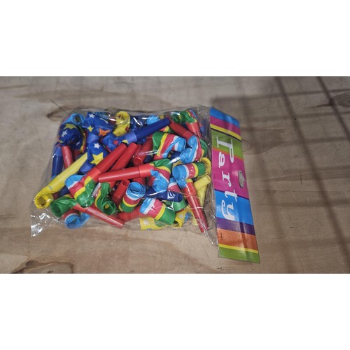 2599 - A box containing 4 smaller boxes with 6 packets of 25 party blowers (approx 600)