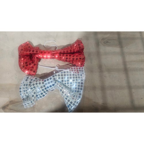 2677 - A box containing a large quantity of sparkly bow ties approx 576