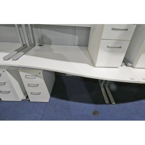 1438 - 1 x white piano / wave front office table approx 140 x 100cm supplied with a white under work top pe... 