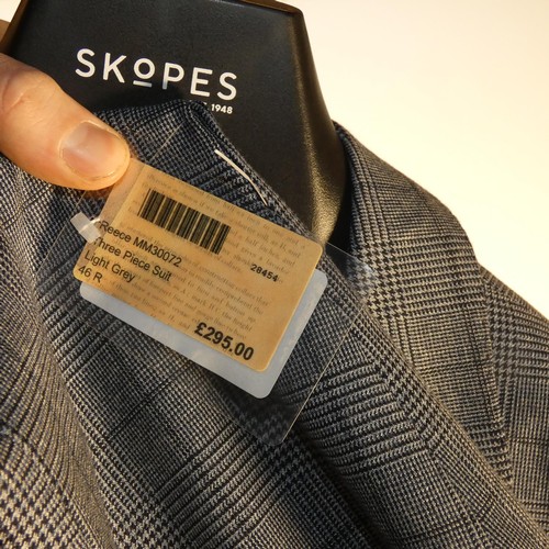 60 - A gentleman's blue check suit by Skopes, jacket 46R & trousers 40R, includes waistcoat, retail price... 