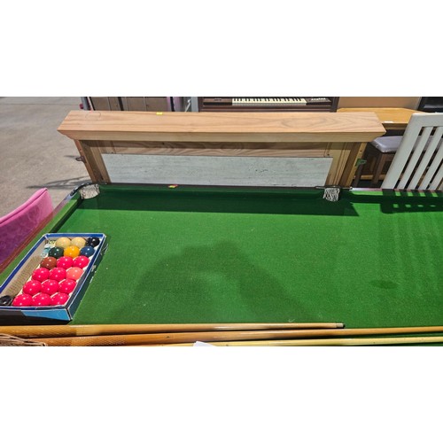 2195 - A snooker table approx 221cm x 115cm (roughly 7ft x 3ft 8 inch) with a quantity of various accessori... 