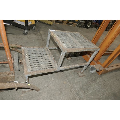 5581 - A metal framed step with anti slip grate treads