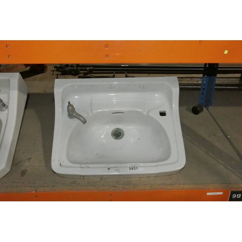 5451 - 1 x white ceramic basin approx 57cm wide with 1 x tap fitted