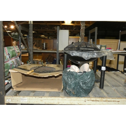 2098 - A black metal fire pit diameter approx 53cm with 2 x spare fire bowls and a quantity of various pebb... 