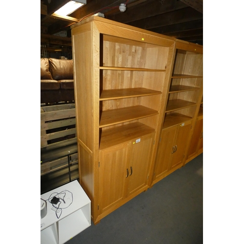 2159 - A light Oak cabinet with 3 shelves above and 2 doors below approx 90 x 38 x 196cm high