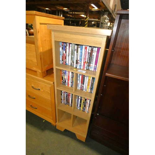 2165 - A wood effect DVD shelf unit approx 44 x 24 x 123cm high containing a quantity of various DVDs