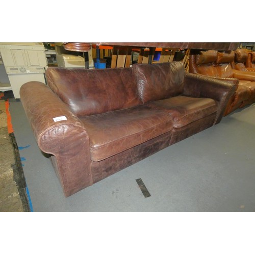 2188 - A brown upholstered two part sofa approx 240cm wide (probably leather upholstered) - Please note tha... 