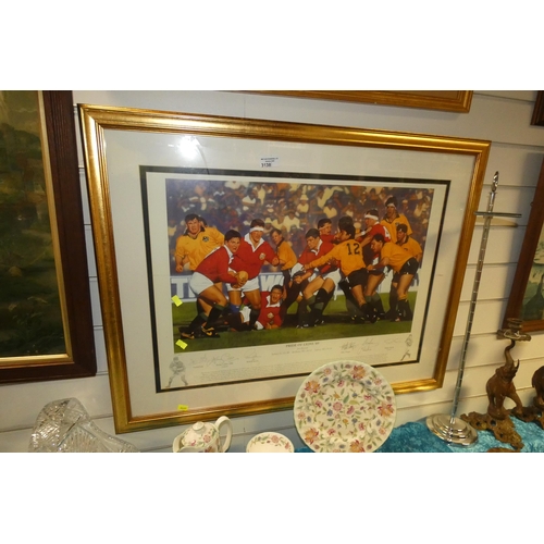 A framed signed print of rugby players titled 