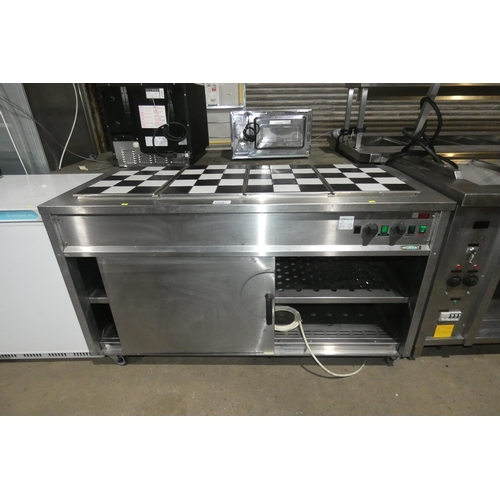 1009 - A commercial stainless steel hot cupboard with 4 section Bain Marie with removable panelled tiled to... 