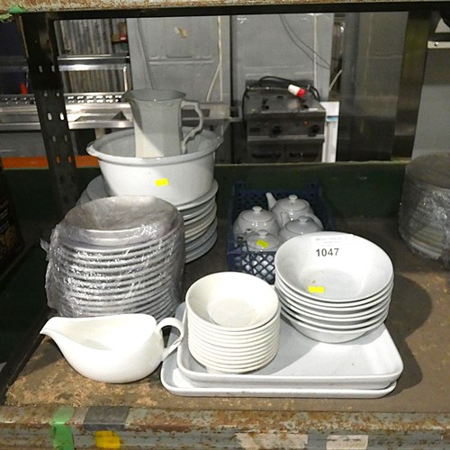 1047 - A quantity of various white crockery by Atlas, Dudson etc