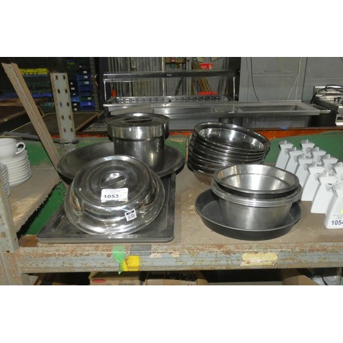 1053 - A quantity of various stainless steel catering related items plate covers, trays etc