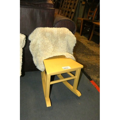 2213 - A child's size yellow coloured wooden rocking chair